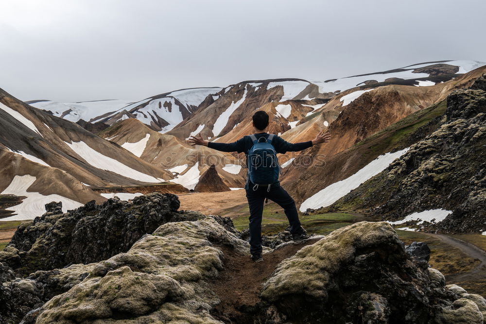 Similar – Young woman climbing the summit