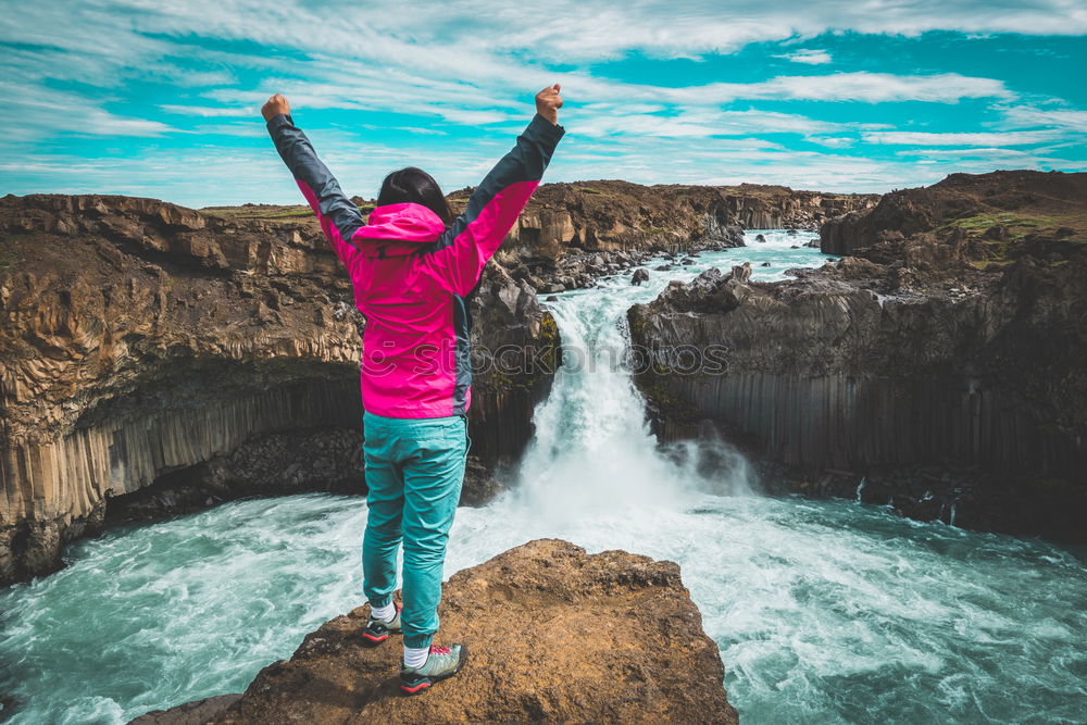 Similar – Tourist jumping over gorge