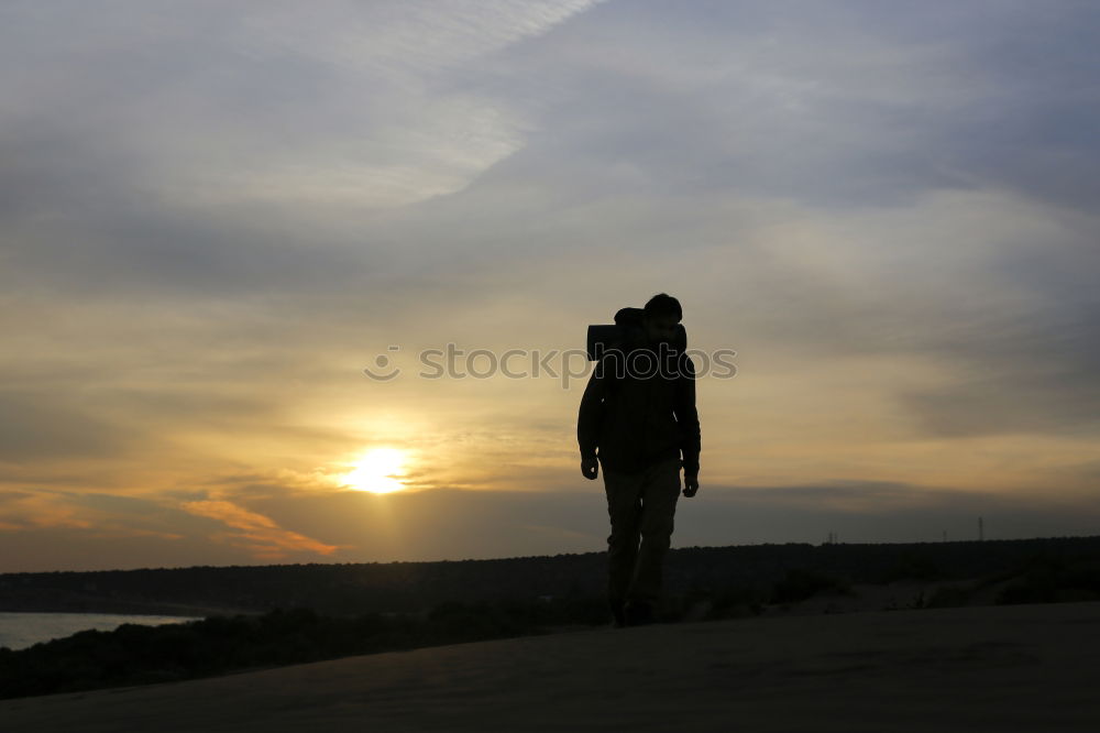 Similar – Image, Stock Photo A young person in the dunes of Hiddensee in bright sunshine with a fantastic view of the sea