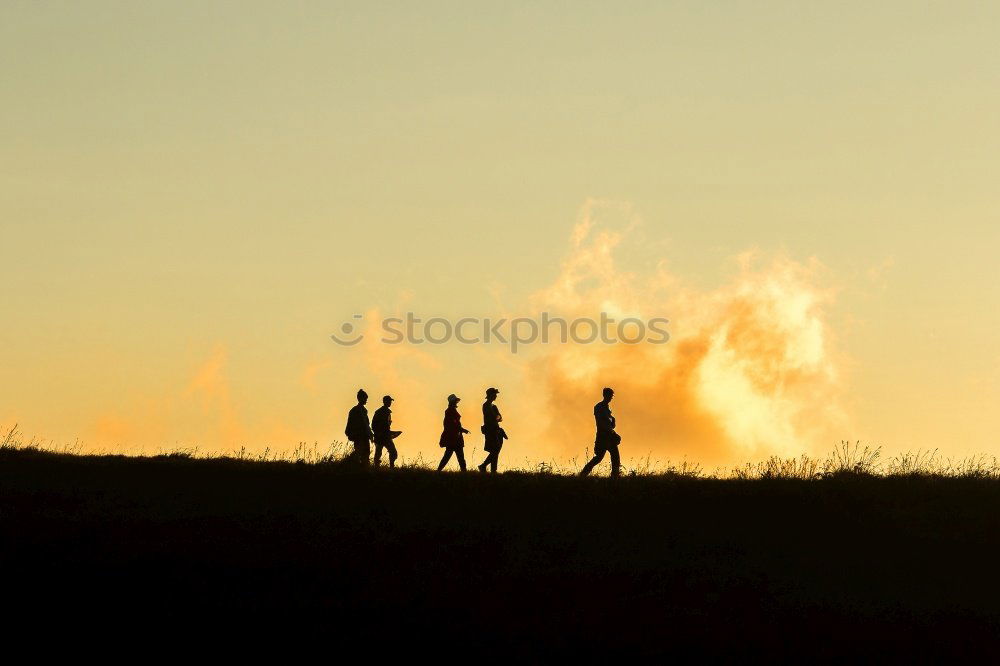 Similar – People on mountain before sunset