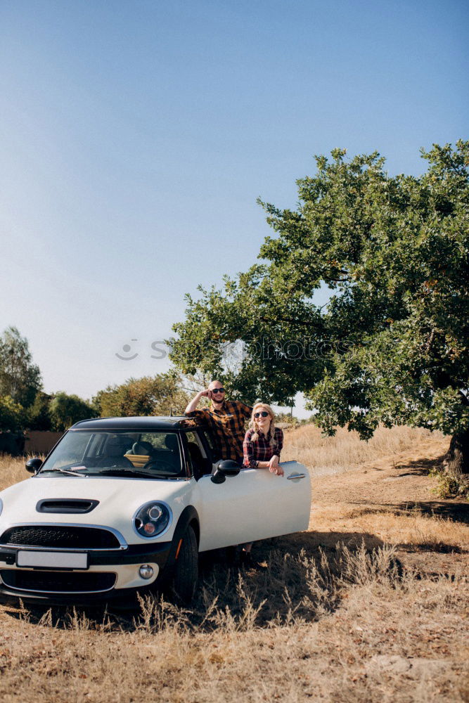 Similar – Black woman driving a vintage convertible car