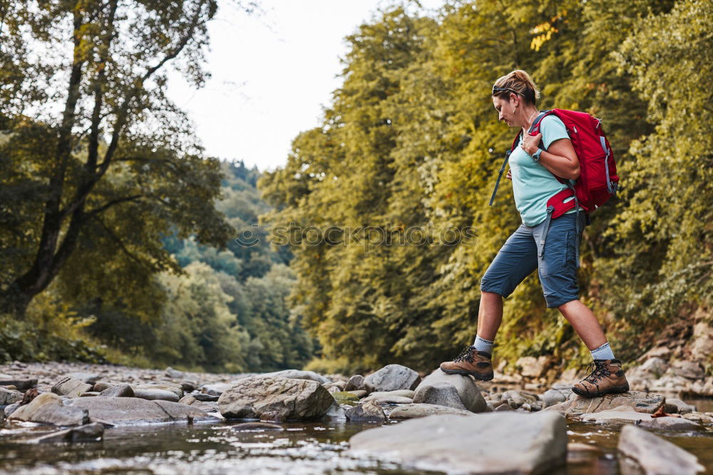 Similar – Young boy taking pure water from a river