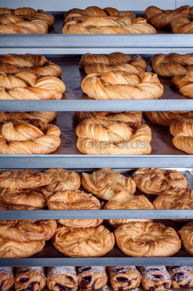 Similar – Baker carrying rack with fresh pastry