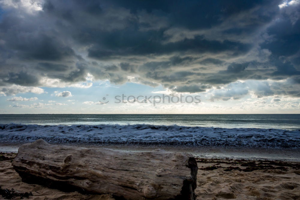 Similar – Steg mit Sonnenschutzdach am Strand bei stürmischer See