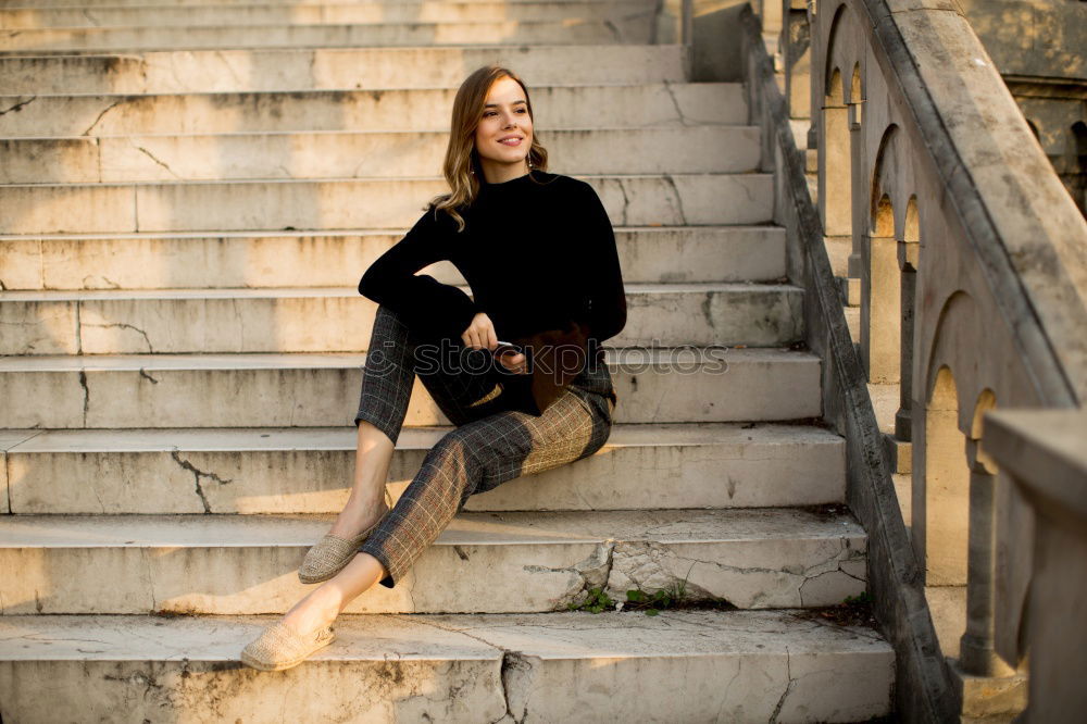 Similar – 50 year old sits on a bench in the sun