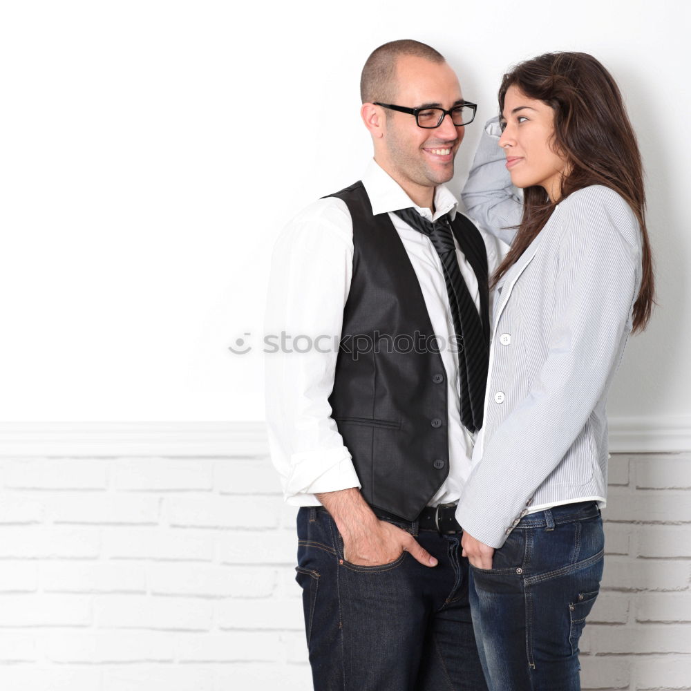 Similar – Side view Happy couple in love jumping against grey wall.