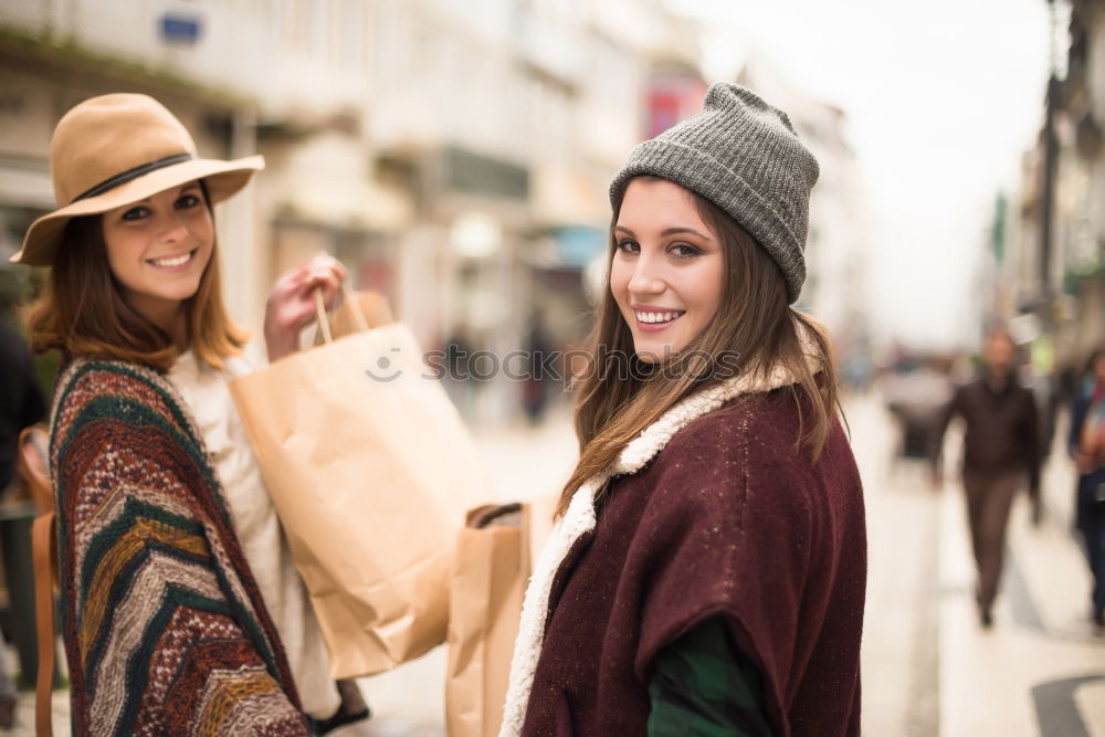 Similar – Two girls sitting on the bench and smile