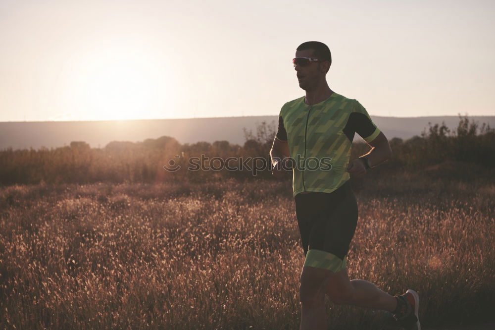 Similar – Image, Stock Photo Fit muscular man jogging on a rural trail