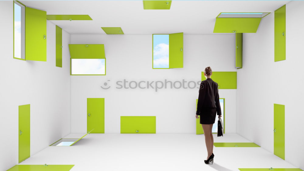 Similar – Woman with umbrella in front of a green wall, in the background skyscrapers