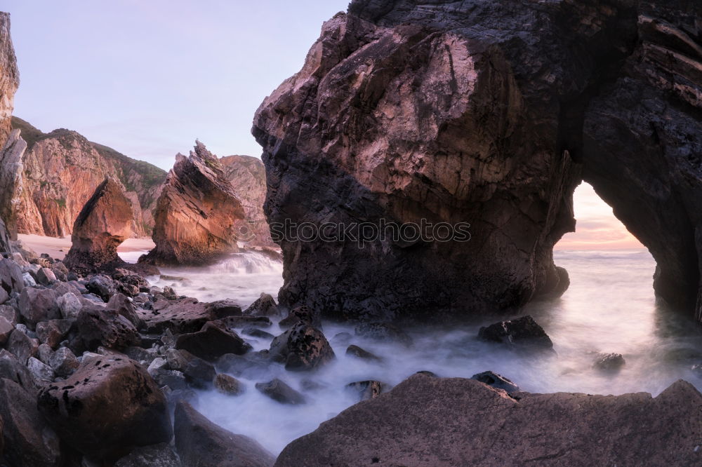 Similar – A Natural Arch on the Coast at Golden Hour