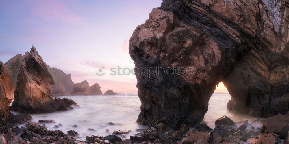 Similar – A Natural Arch on the Coast at Golden Hour