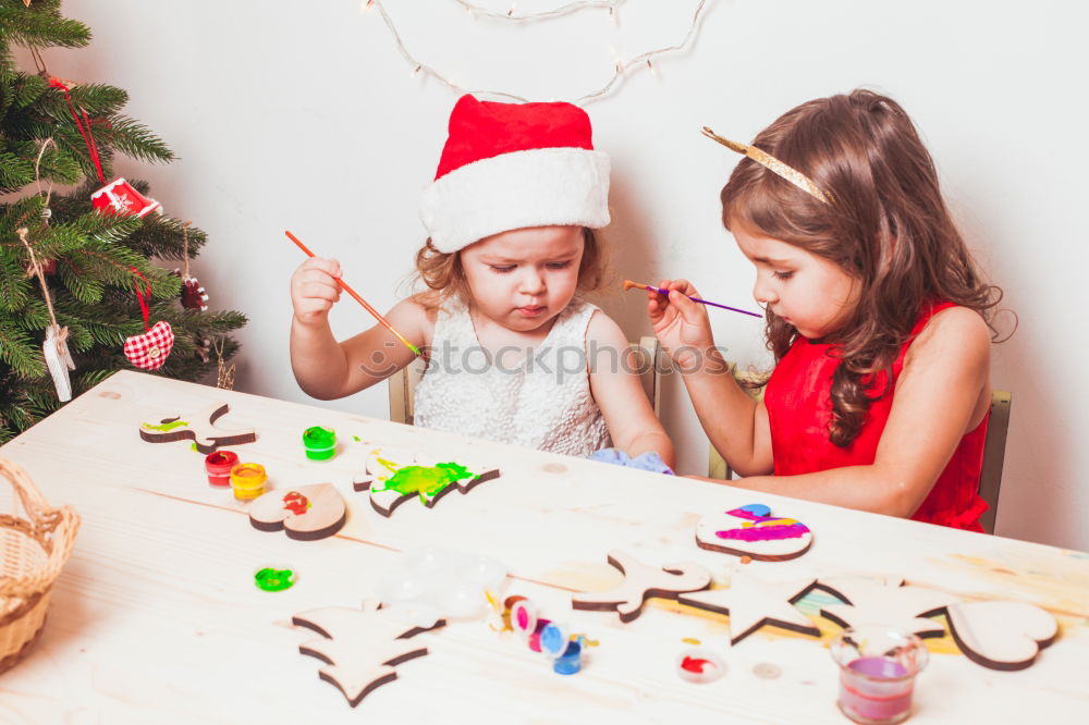 Similar – Mother and son decorating Christmas biscuits at home