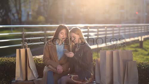 Similar – Image, Stock Photo Two young women looking at an smart phone outdoors