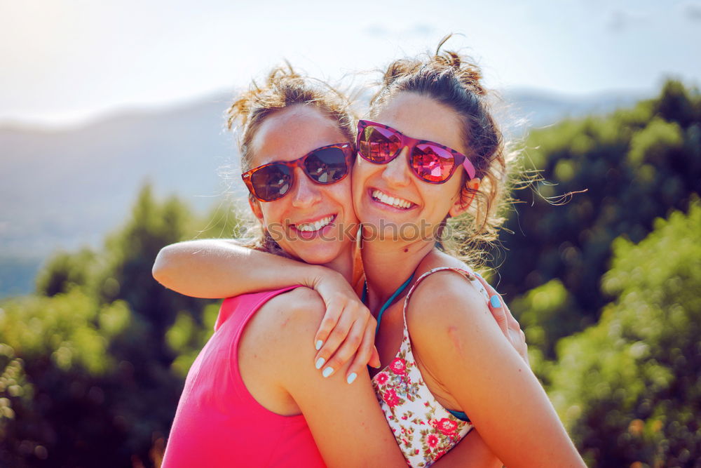 Similar – Tender lesbian couple kissing at sunset