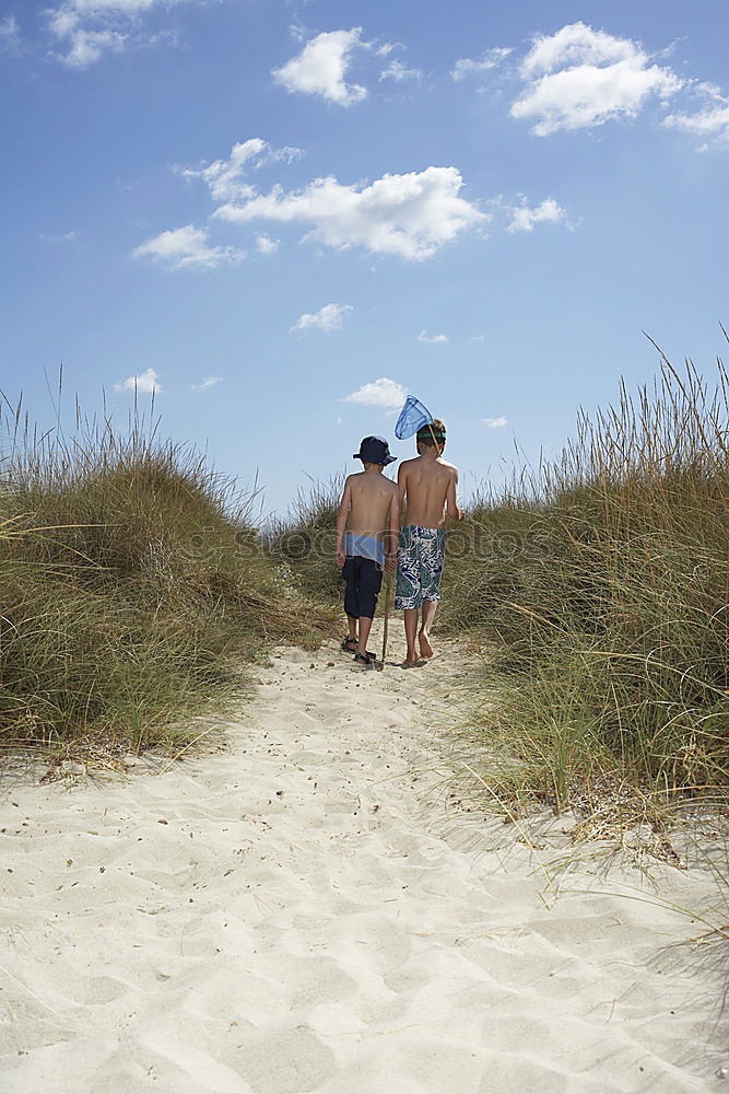 Similar – mother and sun having a walk at the beach