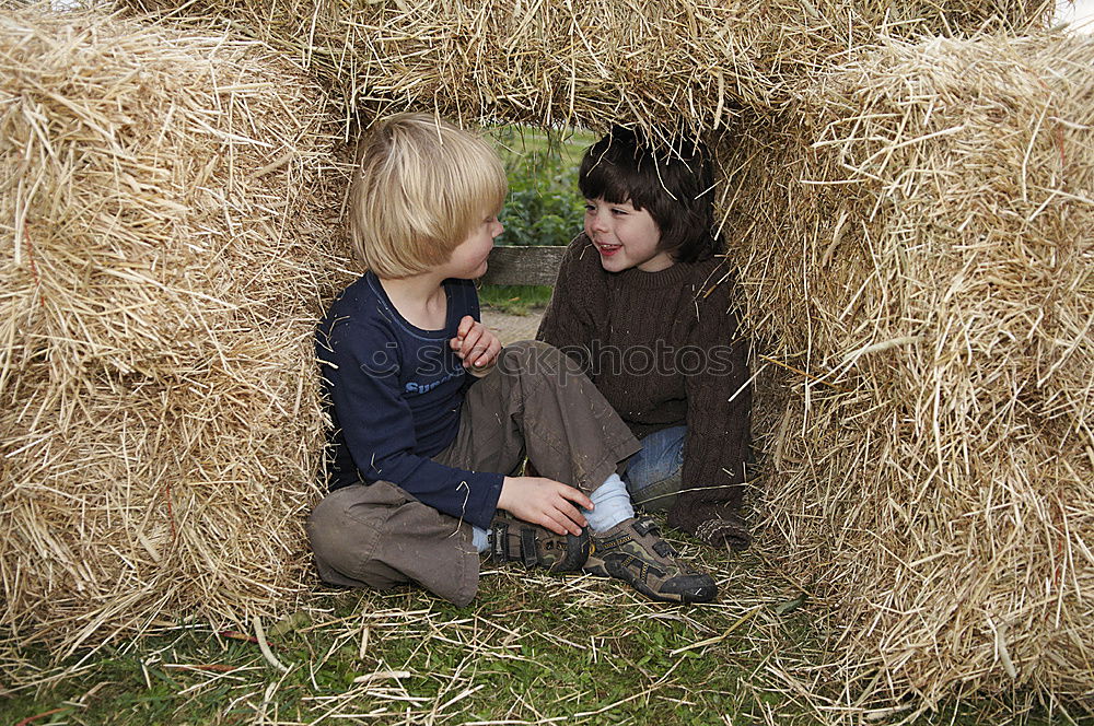 Image, Stock Photo Boy and girl picking up garbage from ground