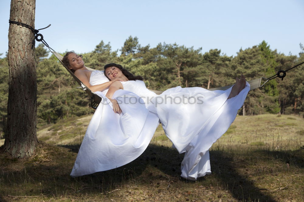 Similar – Three happy friends  posing in the forest