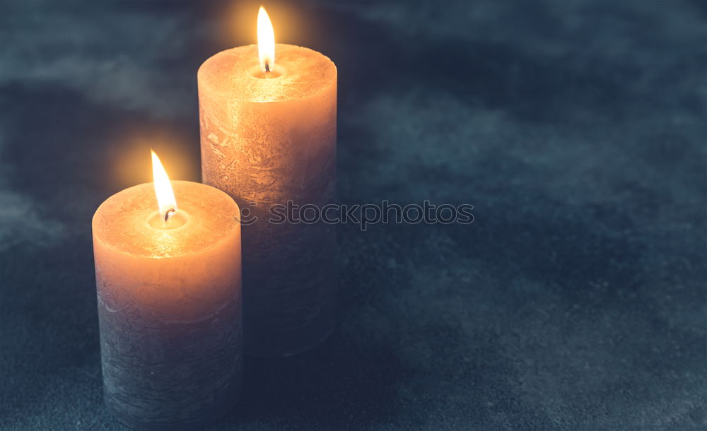 Similar – Image, Stock Photo Burning candle in a hand. Weak depth of field with blue background and some shine.