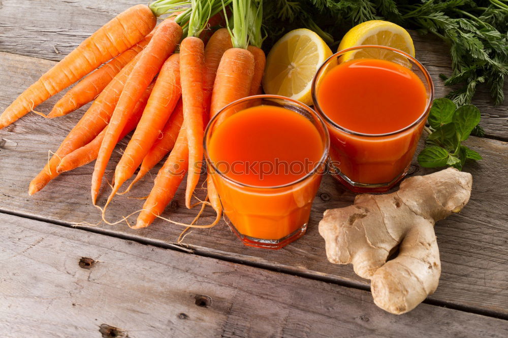 Similar – Image, Stock Photo Two glass jars with fresh carrot juice