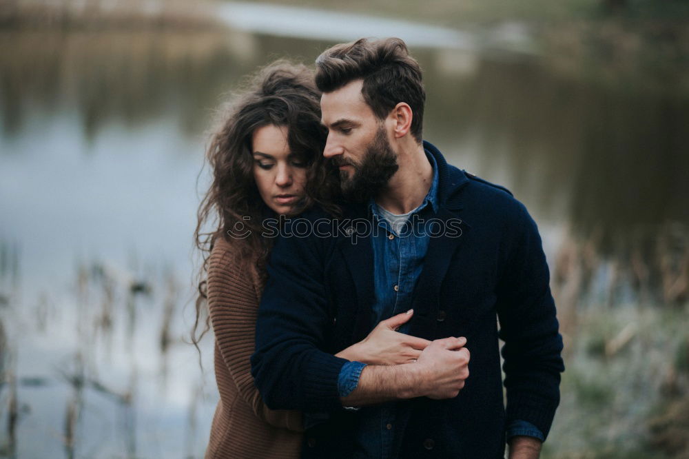 Similar – Blonde girl looks at camera while embraces her bearded boyfriend.