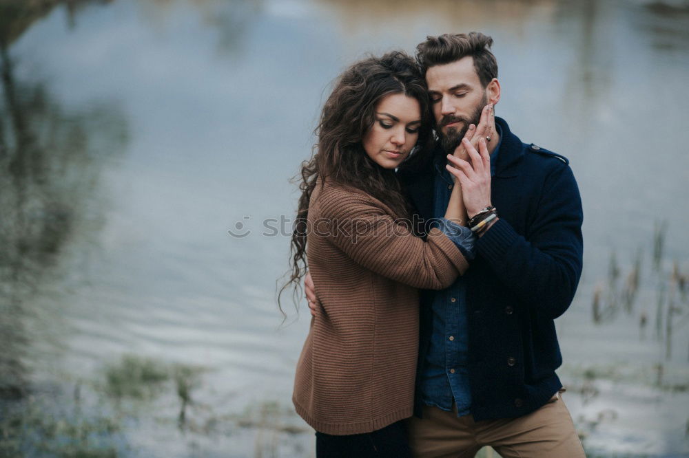 Similar – Blonde girl looks at camera while embraces her bearded boyfriend.