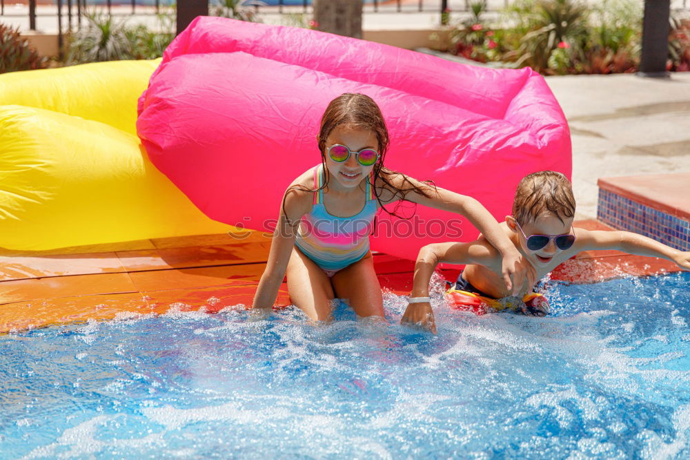 Similar – Two funny kids  in the pool on an air mattress