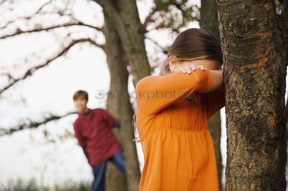 Similar – Younger brother looking back at older brother