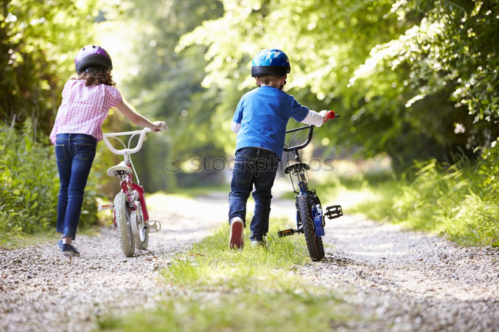 Similar – father and daughter fixing problems with bicycle outdoor