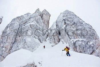 Two climbers next to the Cinque Torri, Dolomiti, Italy.