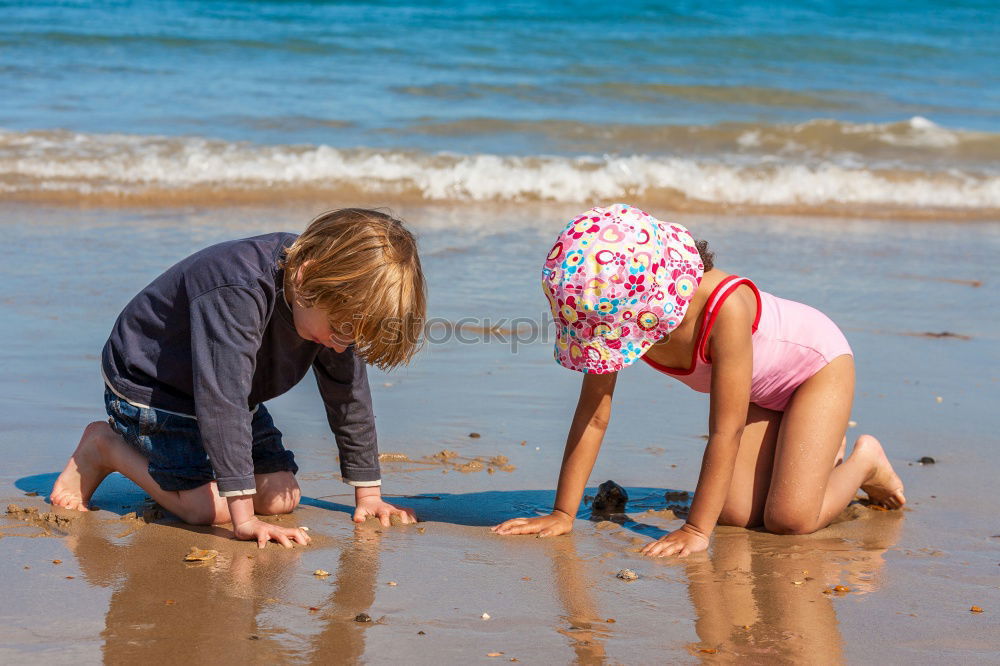 Similar – Two happy children playing on the beach