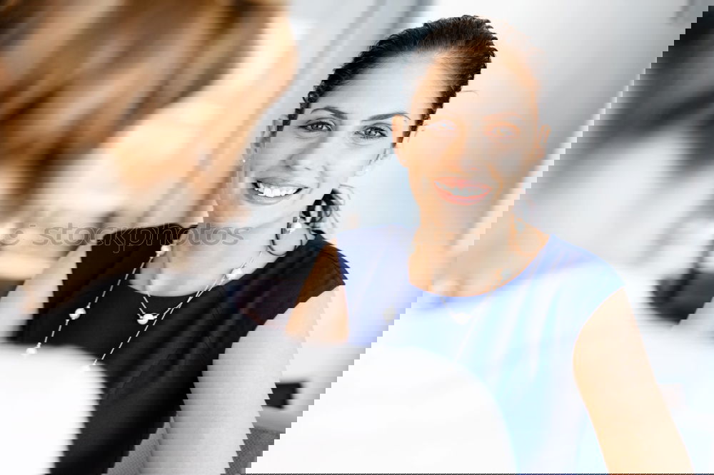 Similar – Image, Stock Photo Two friends talking and laughing on a sofa in the living room at home