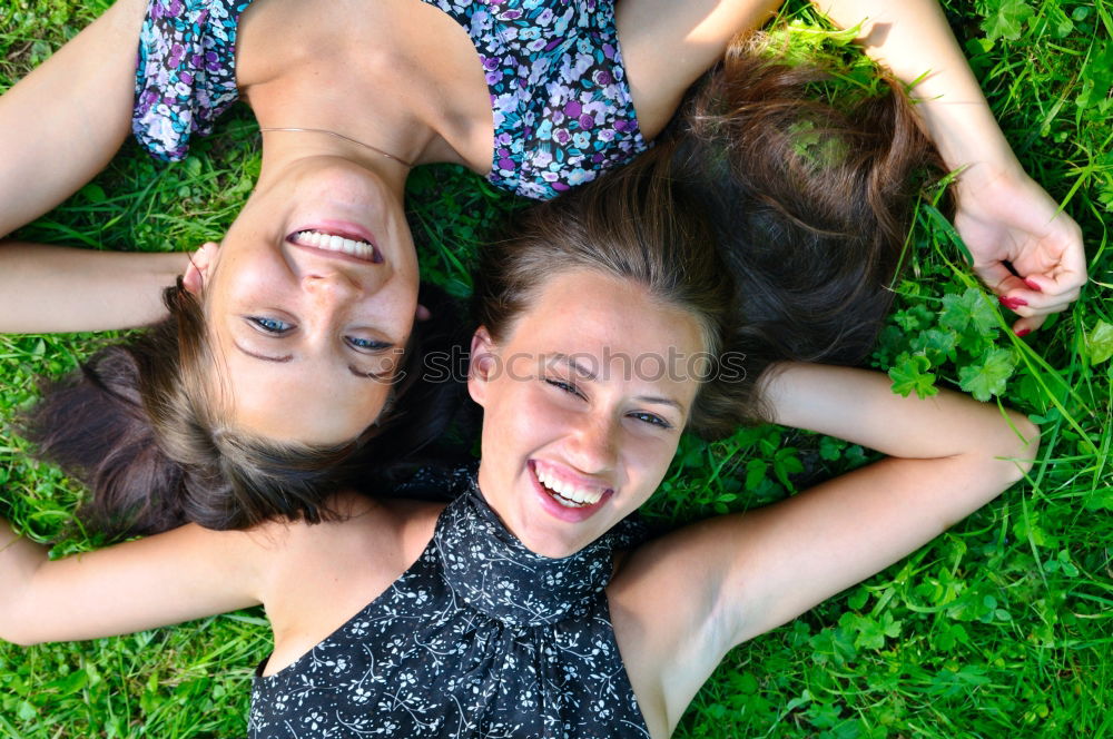 Similar – Happy friends sitting on steps