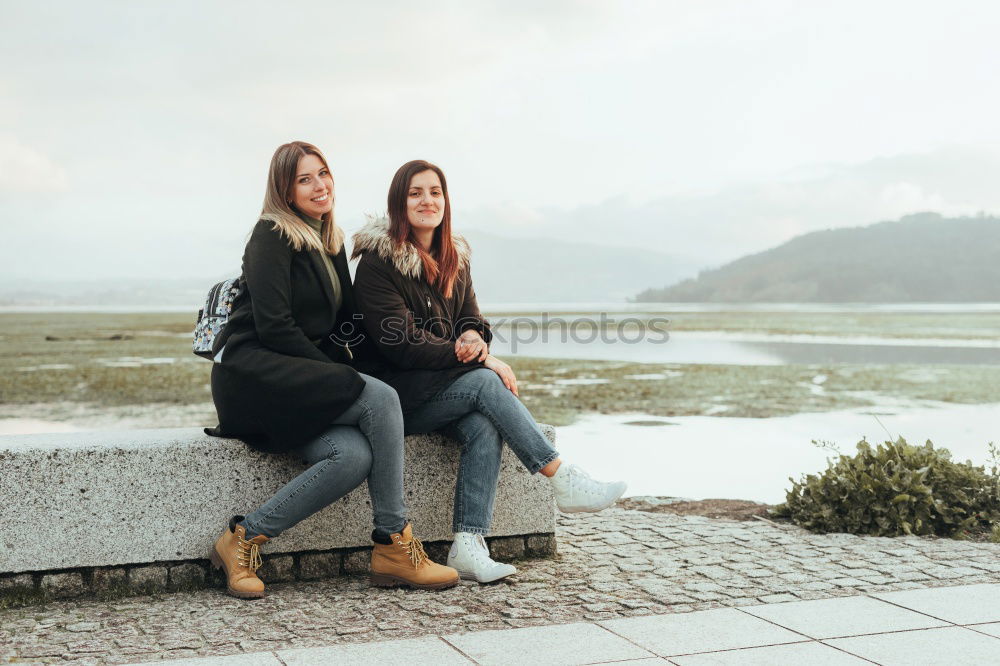 Similar – Women at lake in mountains