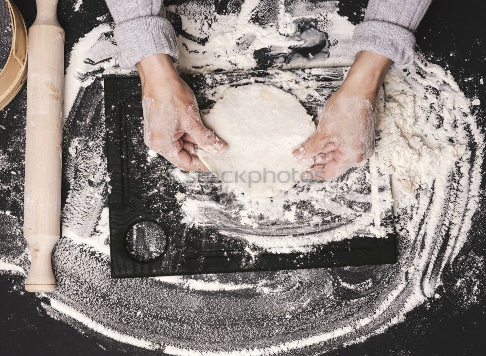 Similar – Hands of woodcarver make wooden bowl