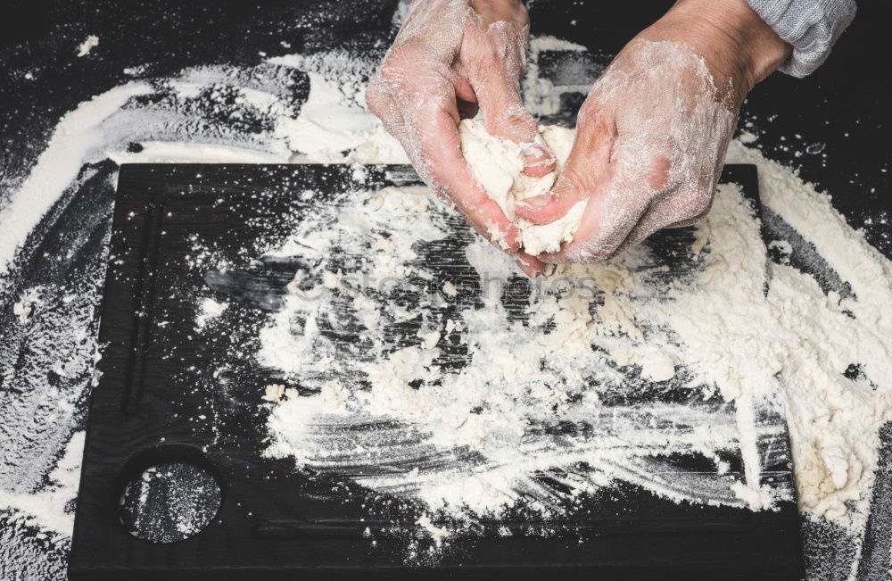 Similar – Hands of woodcarver make wooden bowl