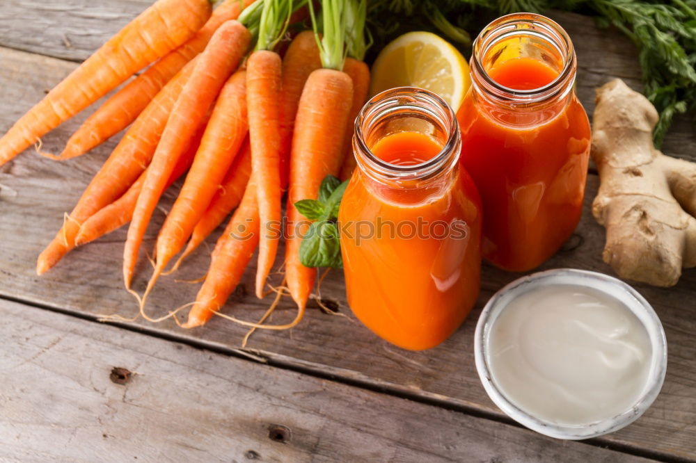 Similar – Image, Stock Photo Two glass jars with fresh carrot juice