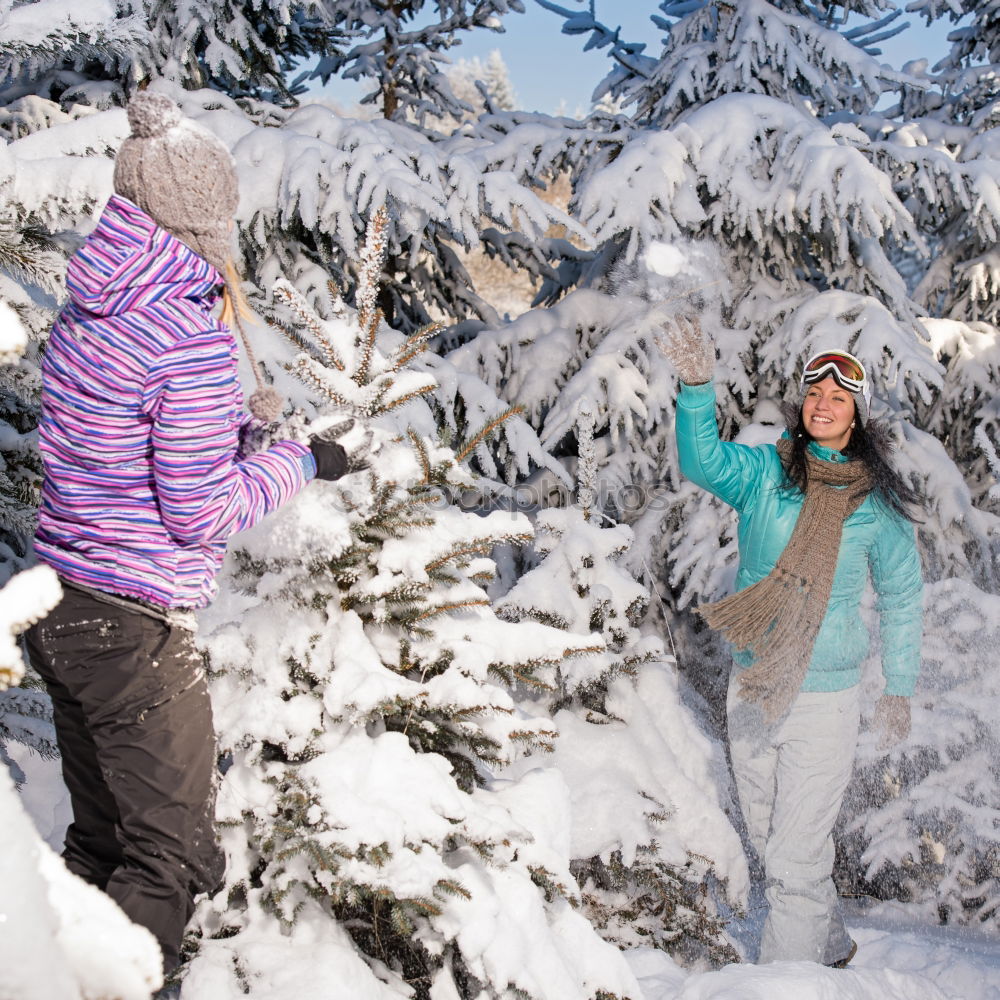 Similar – Young family with children go sledding in winter sunshine