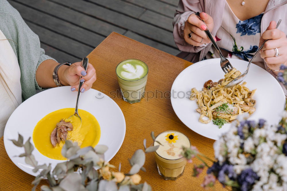 Similar – Group of People enjoying food and wine at restaurant