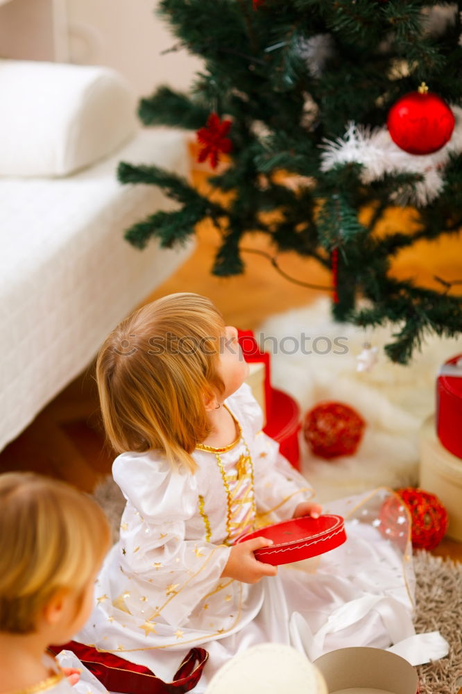 Similar – Girls tying baked Christmas gingerbread cookies with ribbon