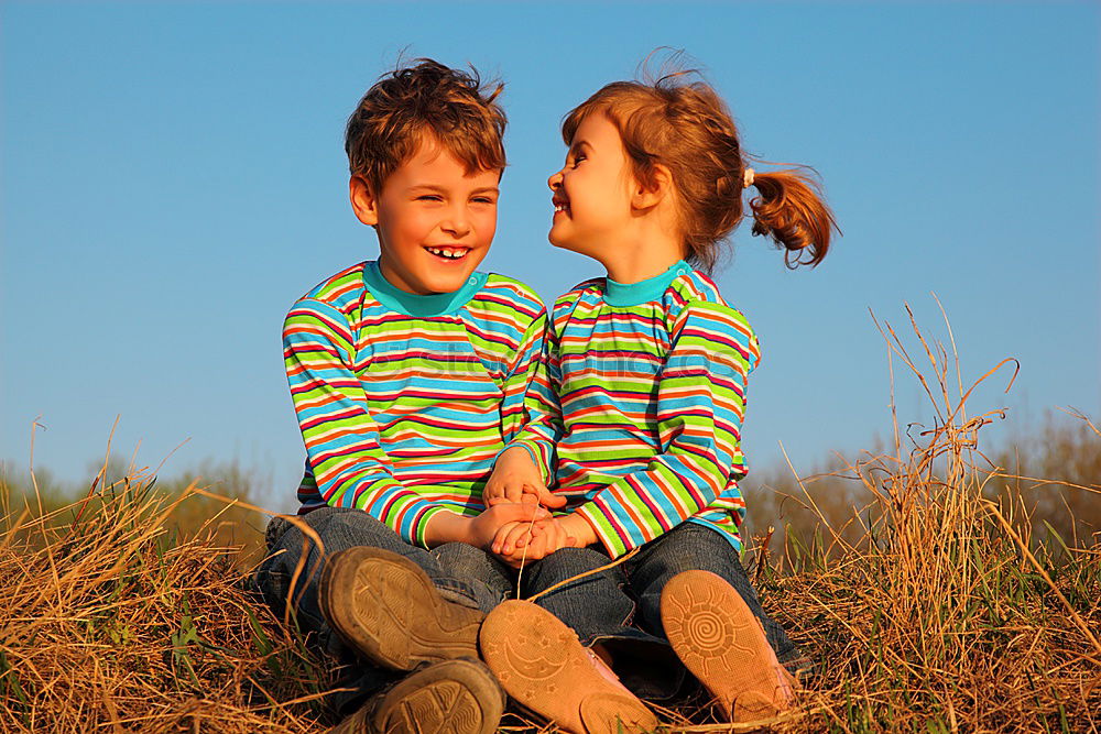 Similar – Image, Stock Photo happy siblings sitting in the field