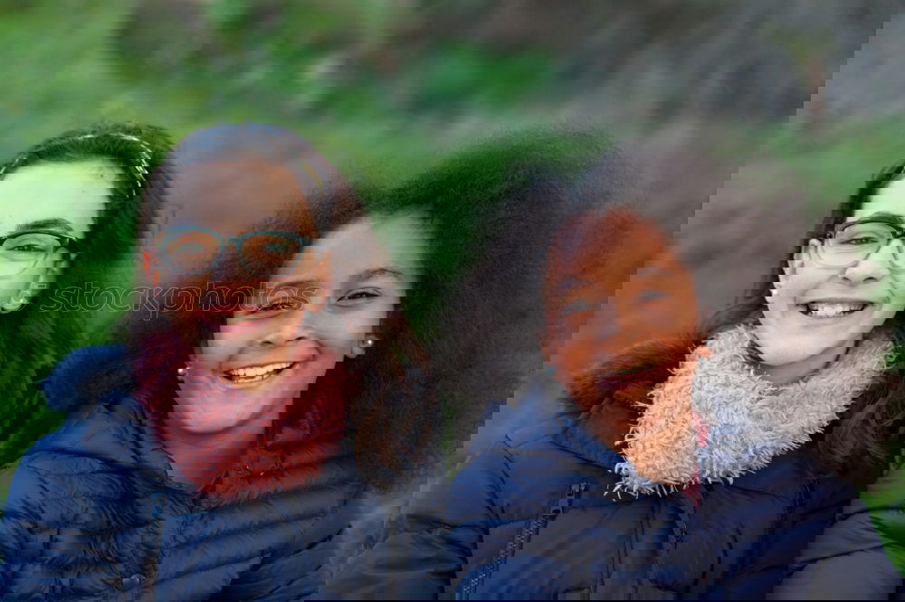 Similar – Image, Stock Photo Two happy girls in the park with coats