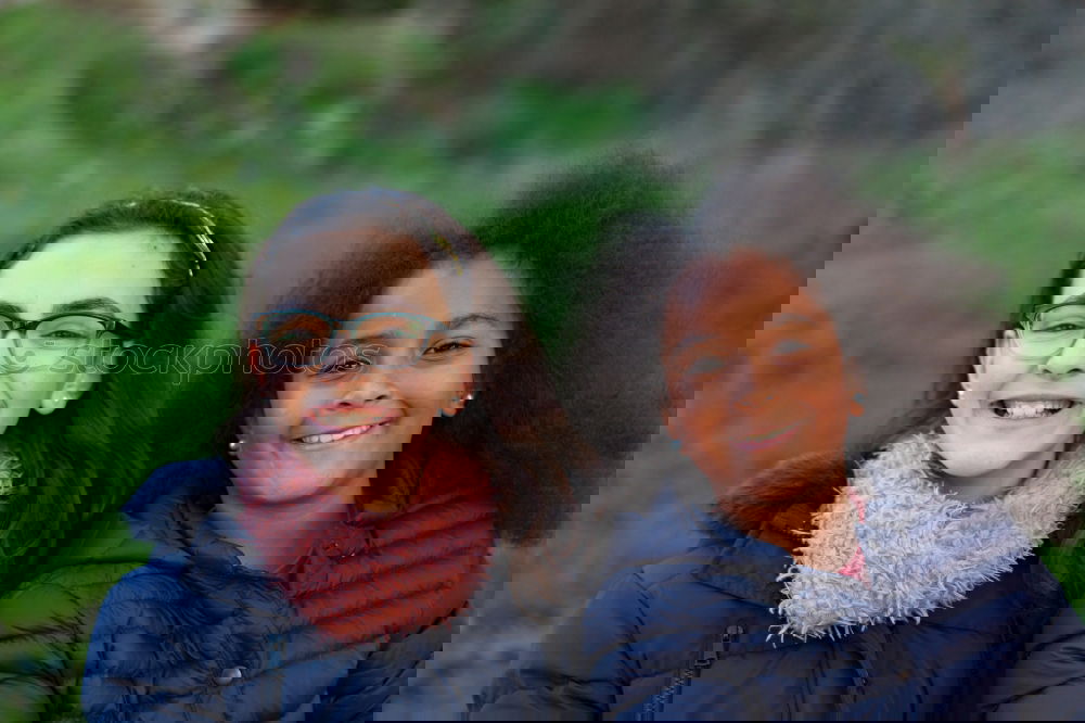 Similar – Image, Stock Photo Two happy girls in the park with coats