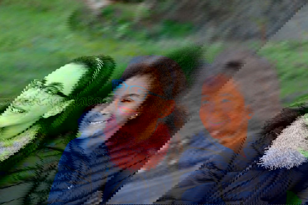 Similar – Image, Stock Photo Two happy girls in the park with coats