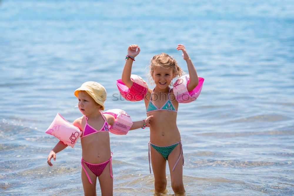 Similar – Two happy children playing on the beach