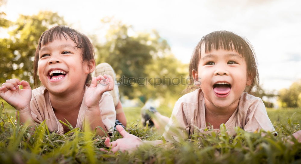 Similar – happy brothers sitting in the park