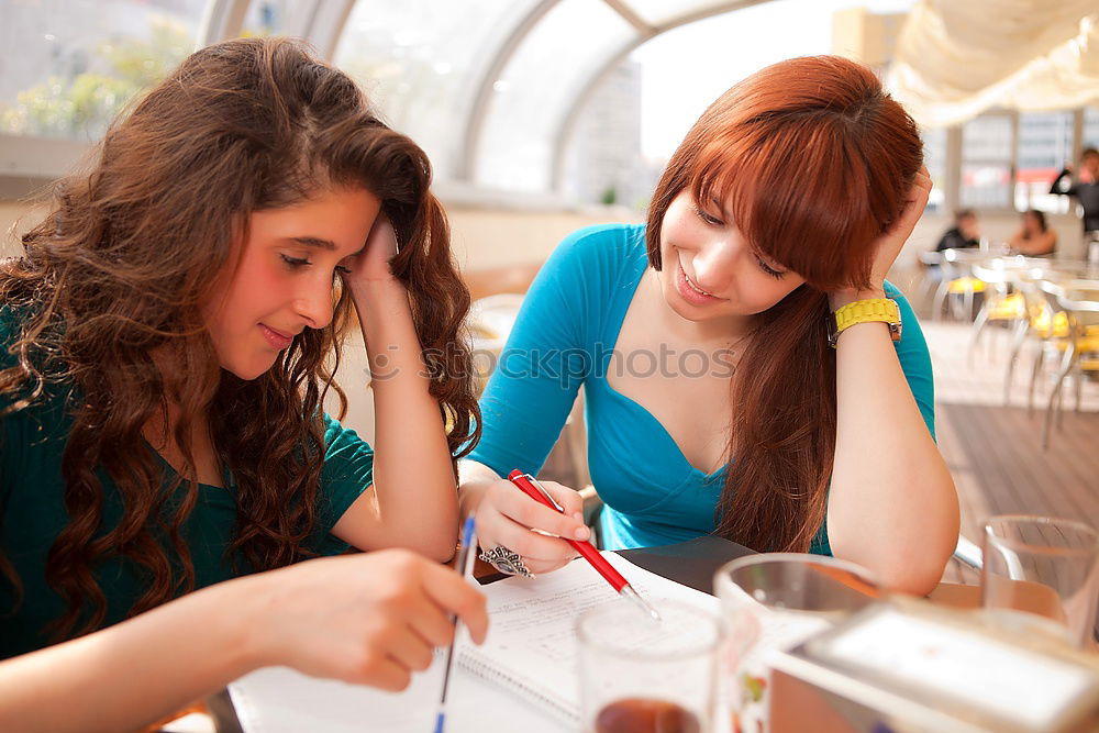 Similar – Image, Stock Photo Two male teenagers surfing the internet on tablet computer while sitting in cafe. One young man pointing at screen