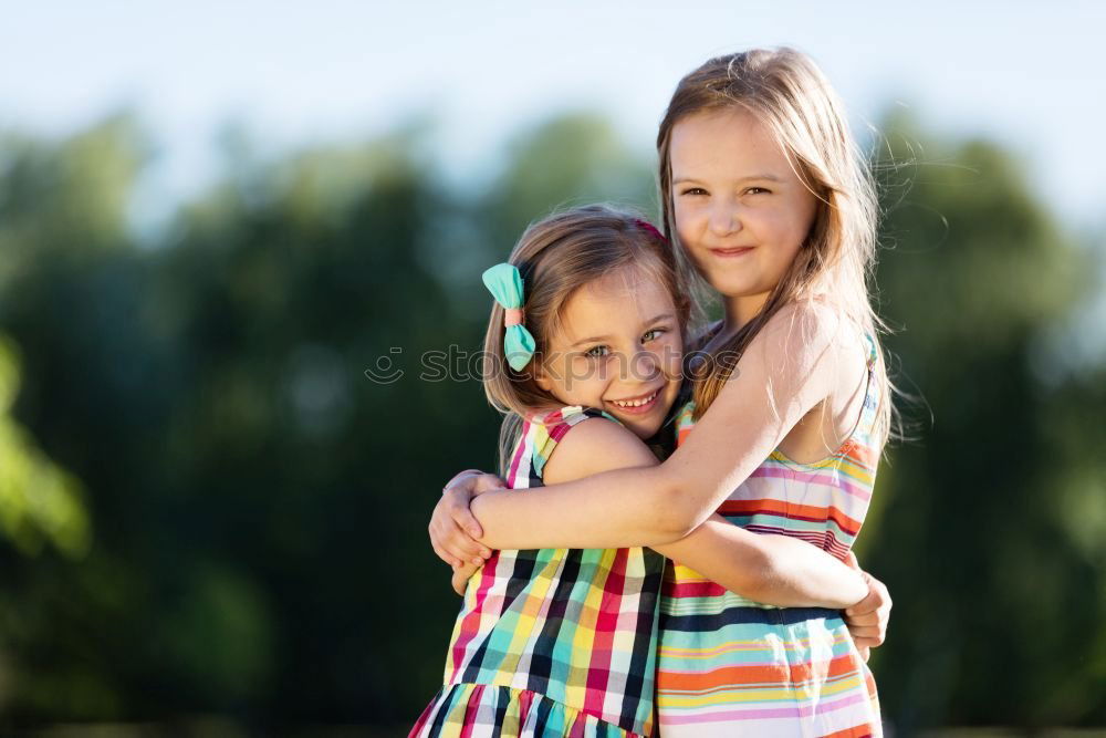 Similar – Baby girl standing on a bench hugging to woman