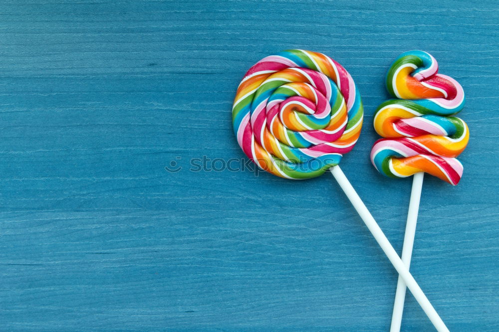 Similar – Colorful lollipop on blue background. Top view. Copyspace