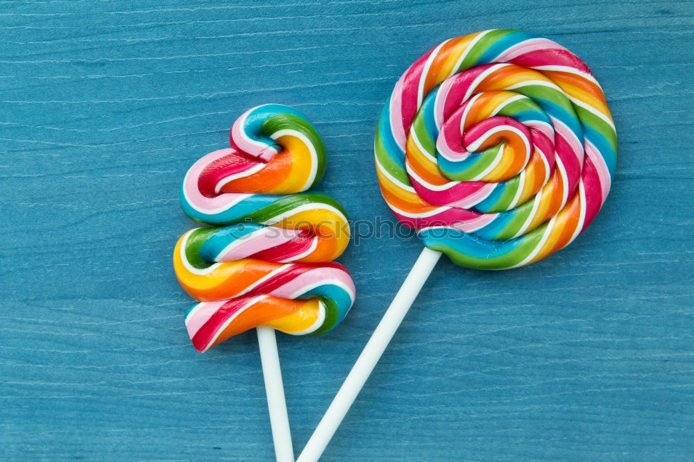 Colorful lollipops on blue background.