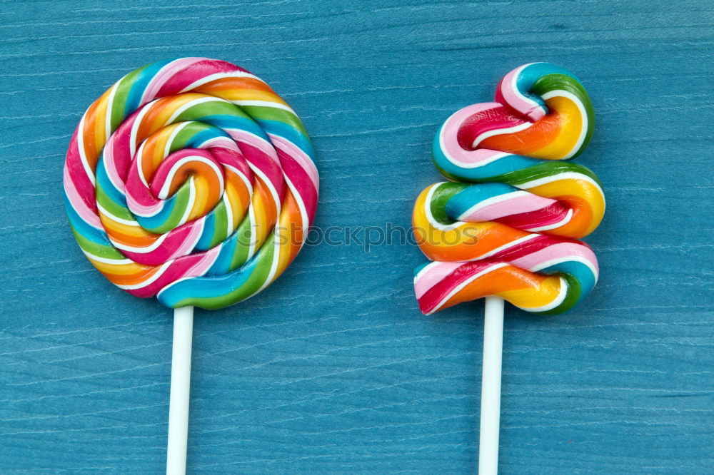 Similar – Colorful lollipops on blue background.